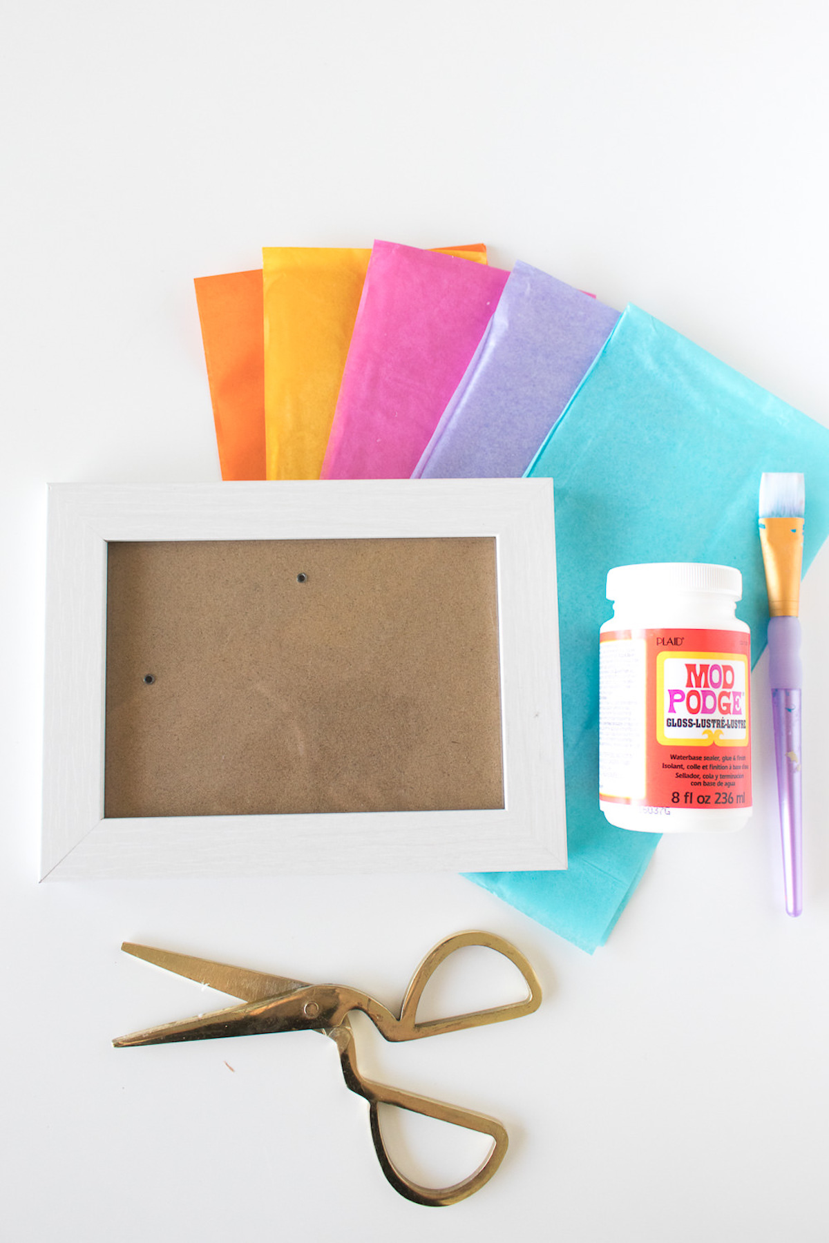 tissue paper, Mod Podge, scissors, and a frame
