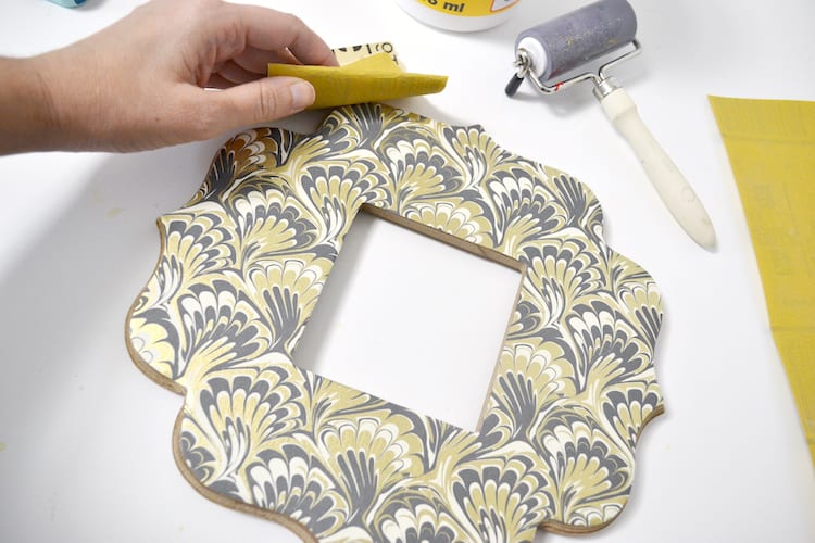 Sanding the edges of the frame