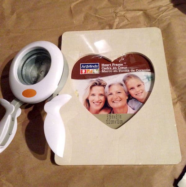 Frame with heart shaped opening and a circle punch