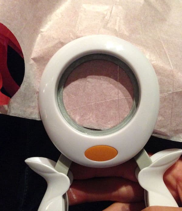 Using the punch to punch out several circles from the tissue paper