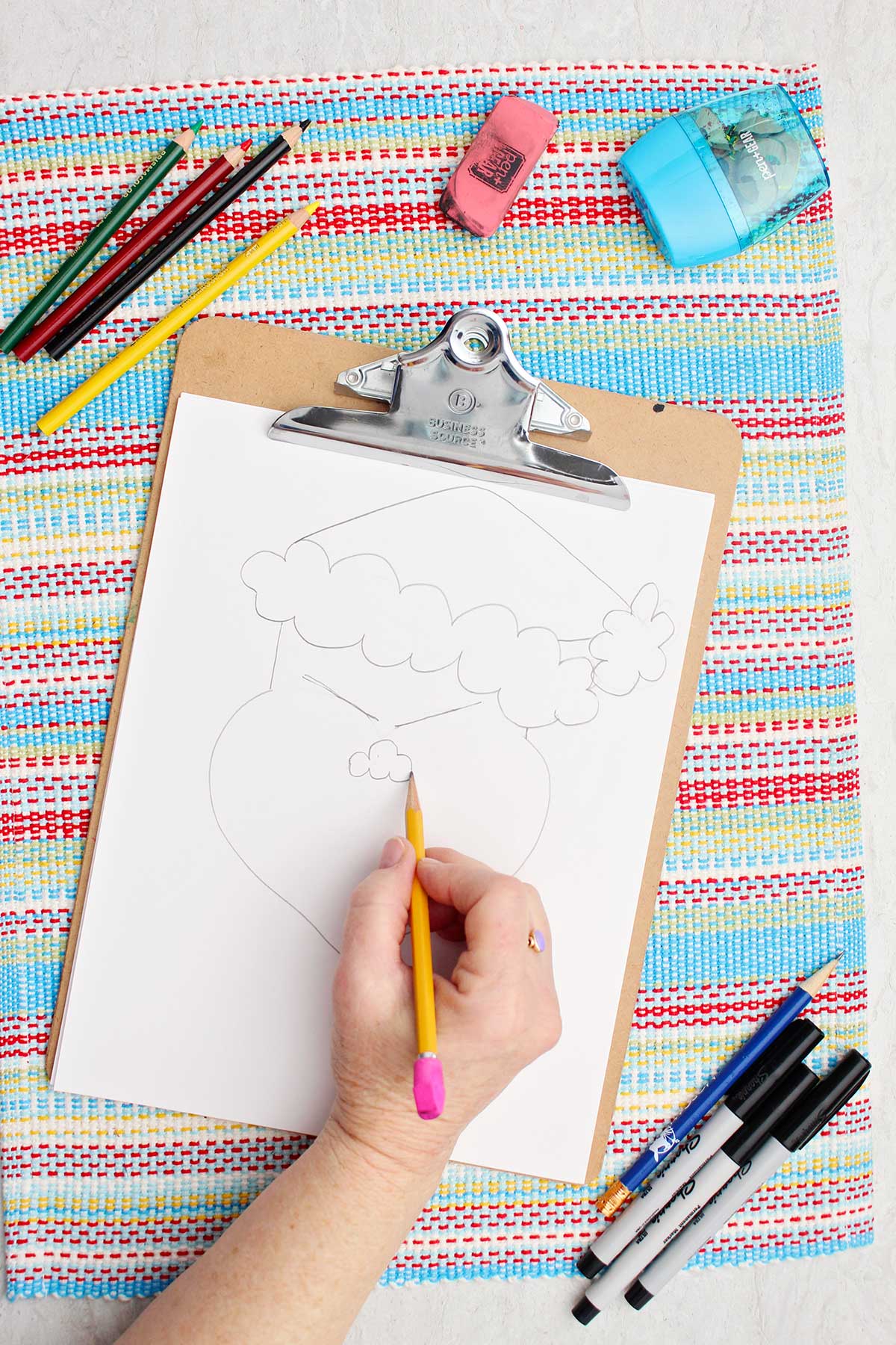 Individual adding nose features to their Grinch illustration.