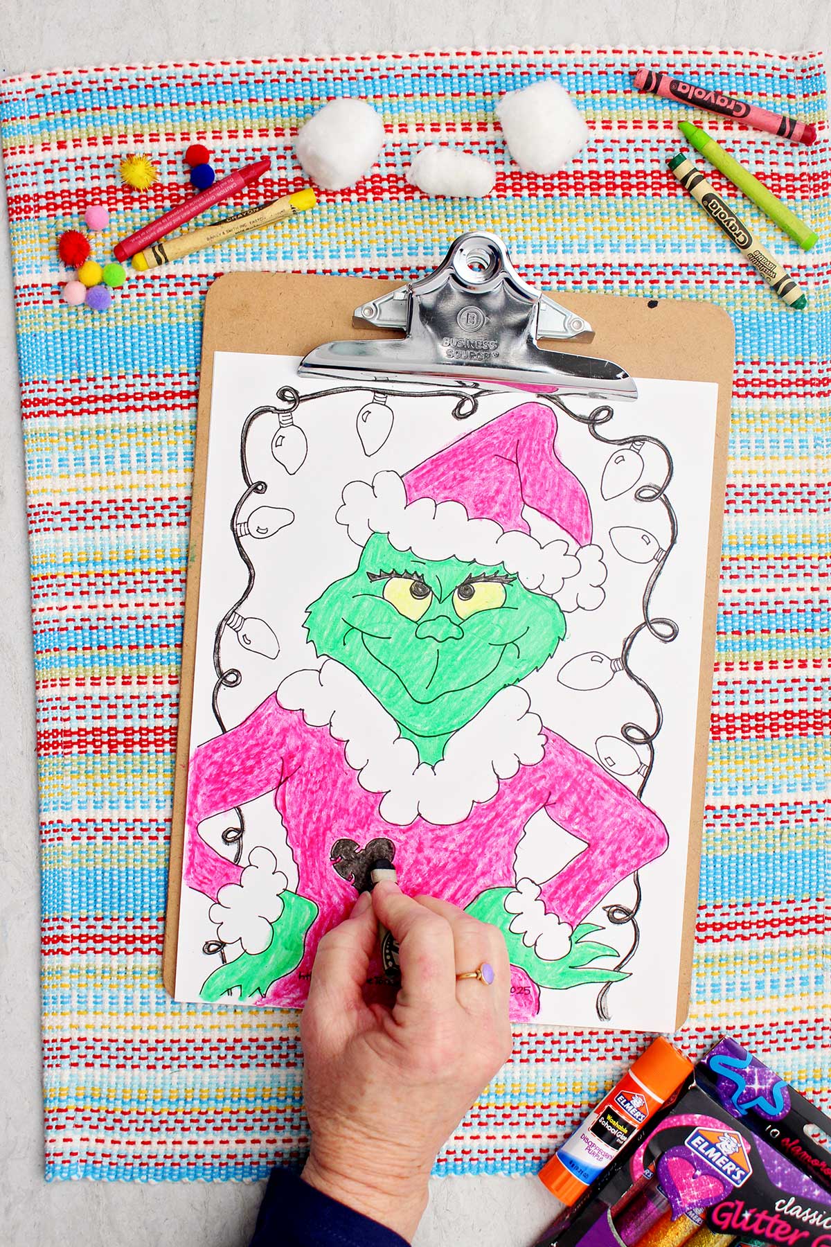 Individual coloring heart on coat on Grinch coloring page.