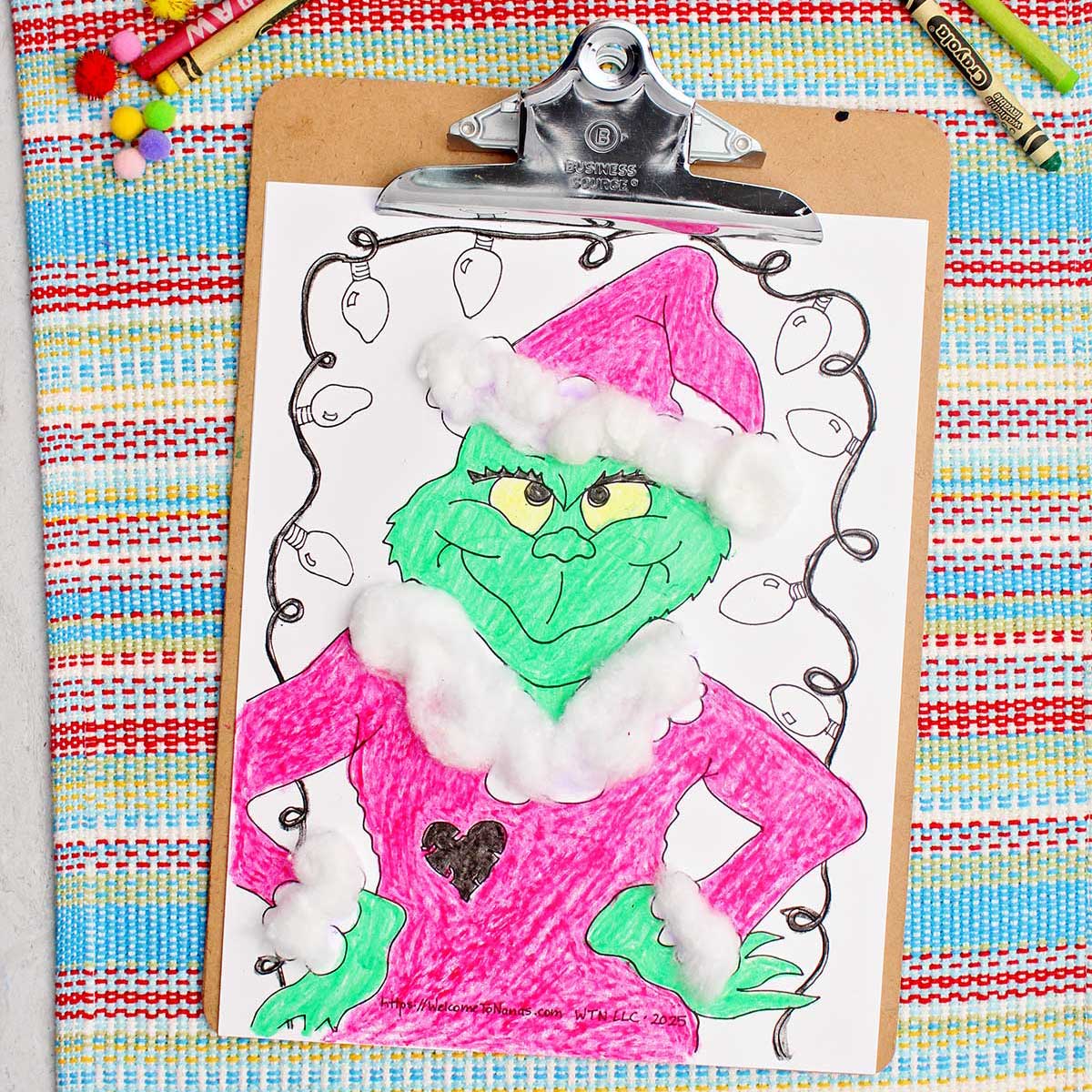 Final Grinch colored printable featuring cotton ball decorations affixed to a clipboard.