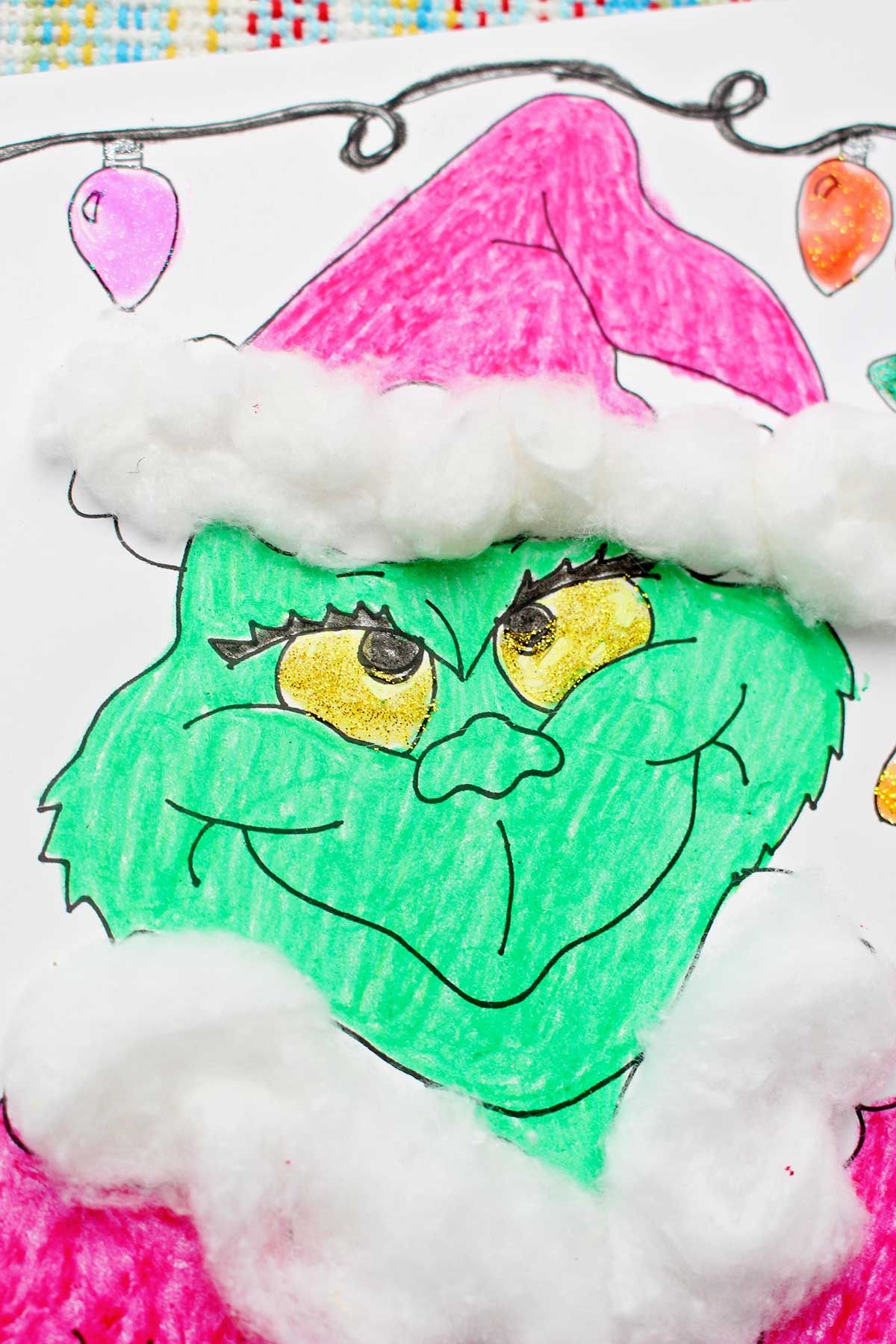 Close up of a finished Grinch coloring page.