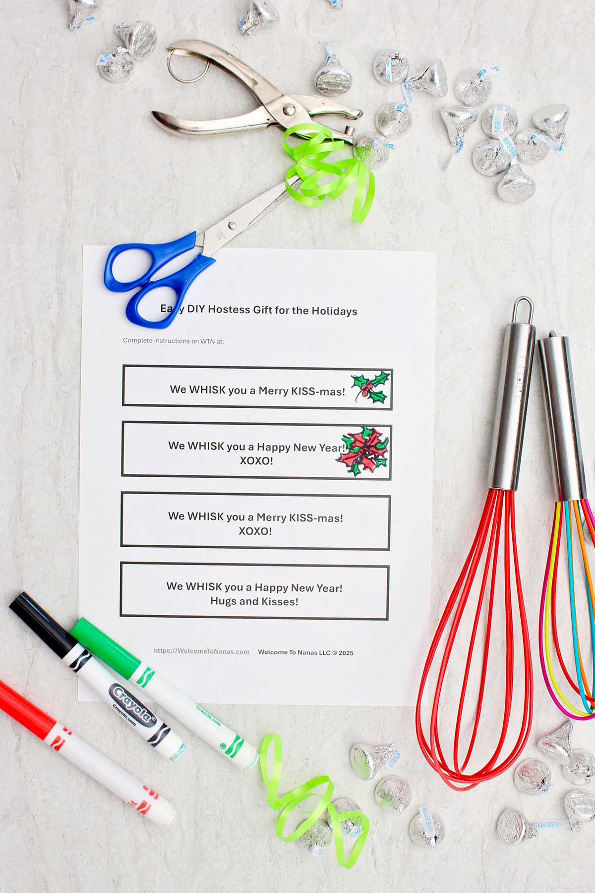 Colorful whisks, markers, scissors, candies and printable notes.