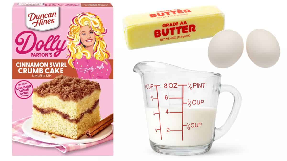 Baking components laid out on a white backdrop, including a cinnamon swirl cake mix package, butter, two eggs, and a glass measuring cup filled with milk.