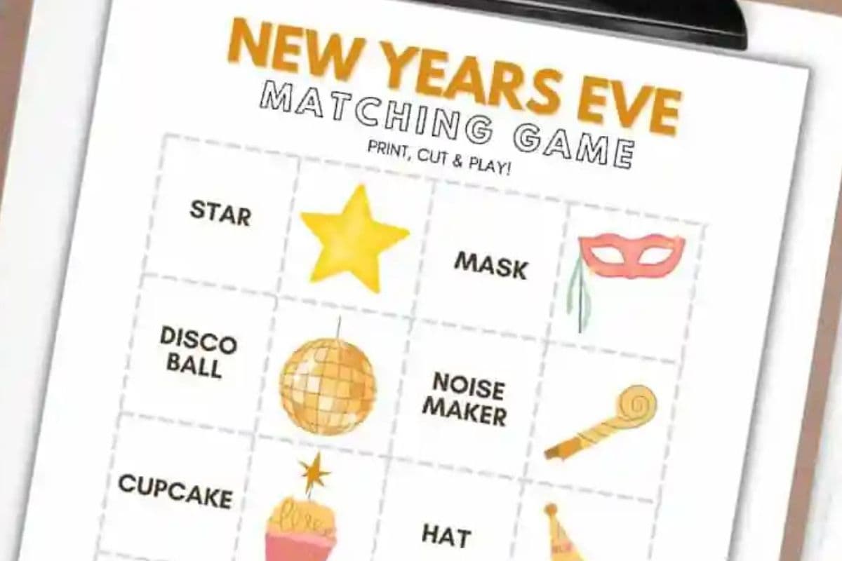 A printable New Year's Eve memory game featuring illustrations such as a star, mask, disco ball, noise maker, cupcake, and hat, with "Print, Cut & Play!" instructions.