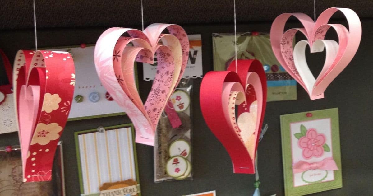 Four suspended paper strip hearts.