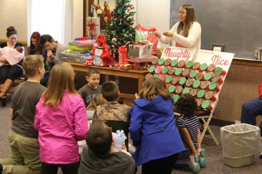 A family engaging in the Naughty or Nice Christmas Game.
