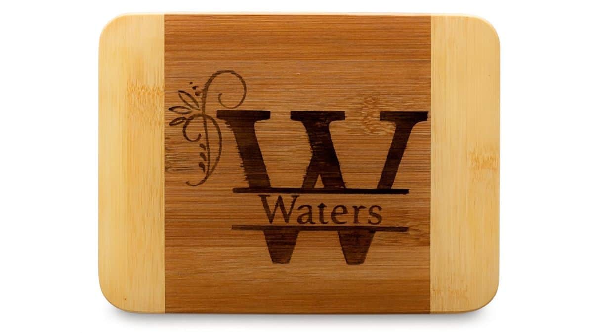 Customized bamboo cutting board displaying the W monogram and the surname Waters.