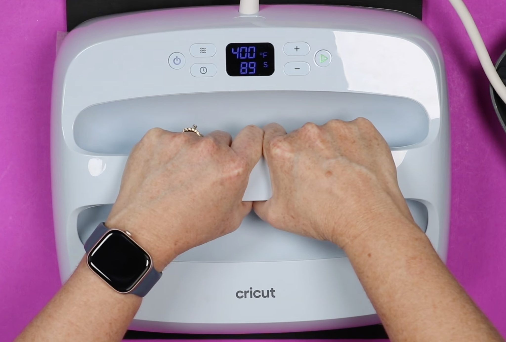 Apply pressure to design with Cricut EasyPress.