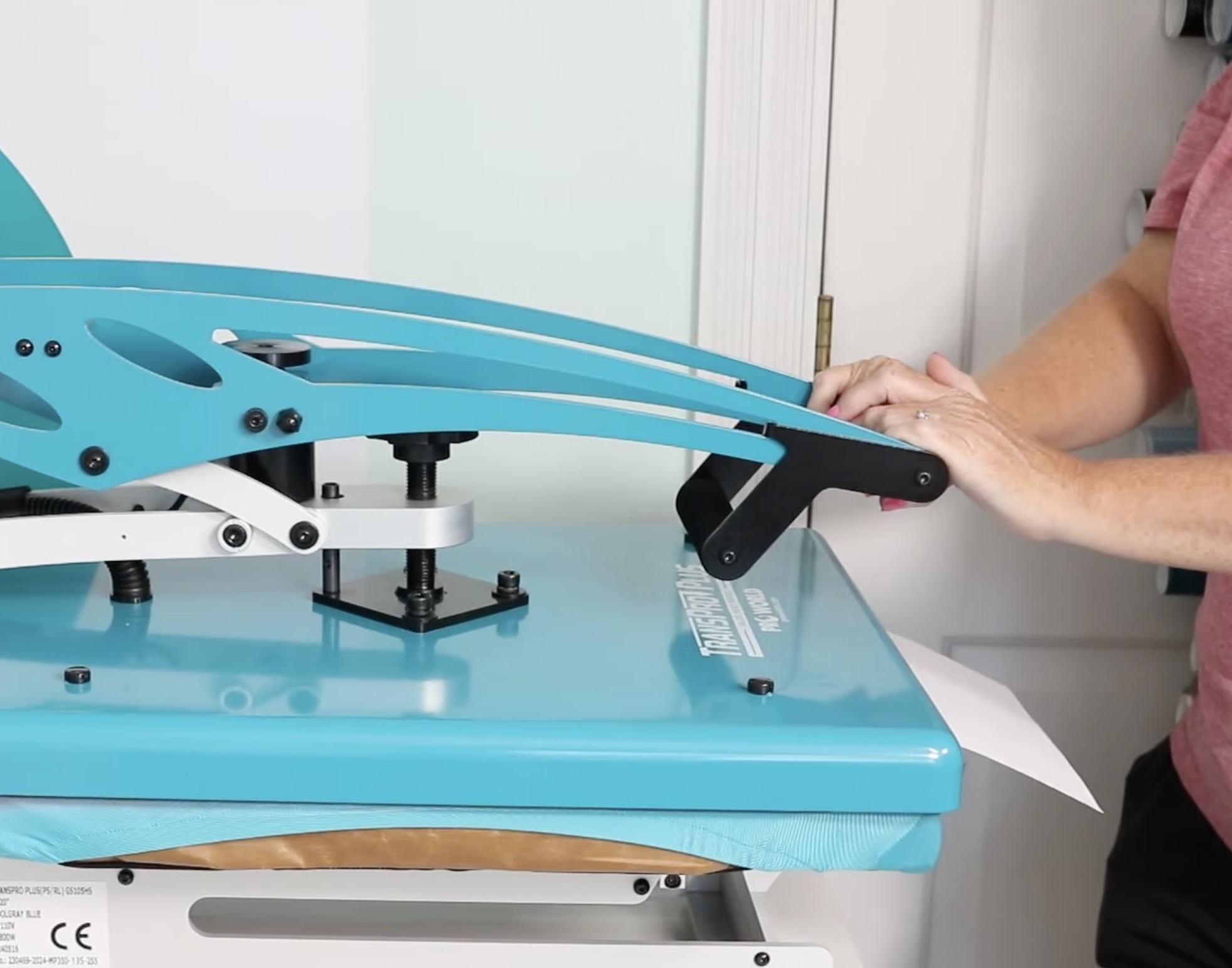 Shut the press with paper sticking out halfway.