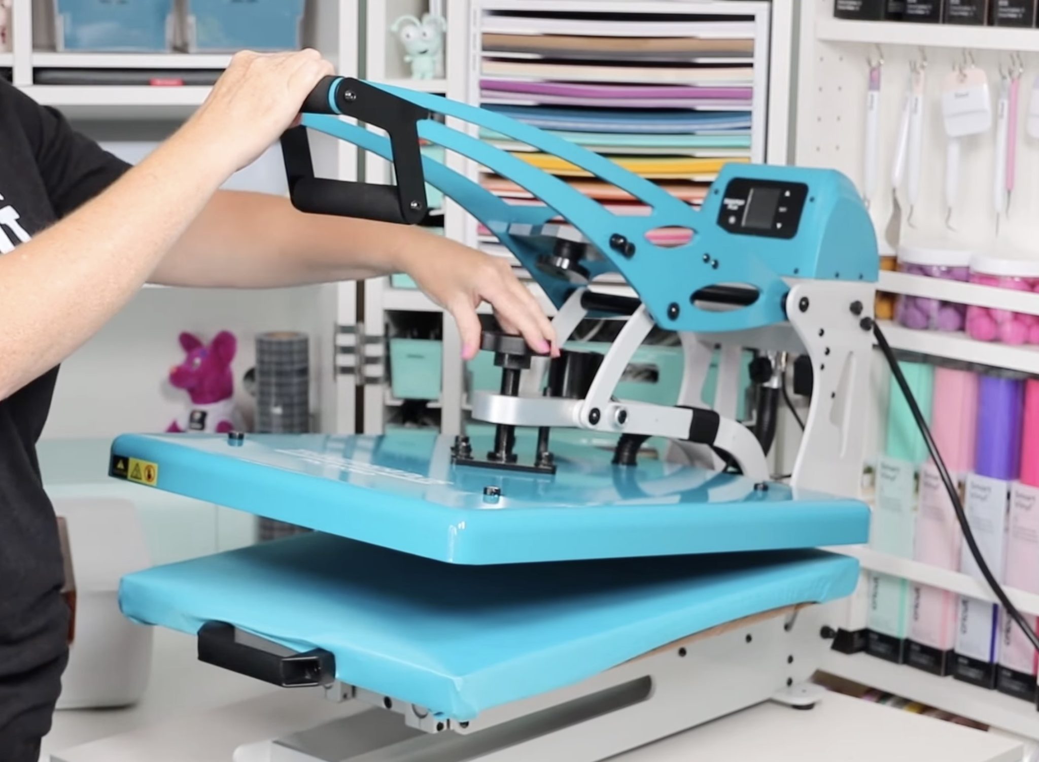 Regulate heat press pressure with knob.