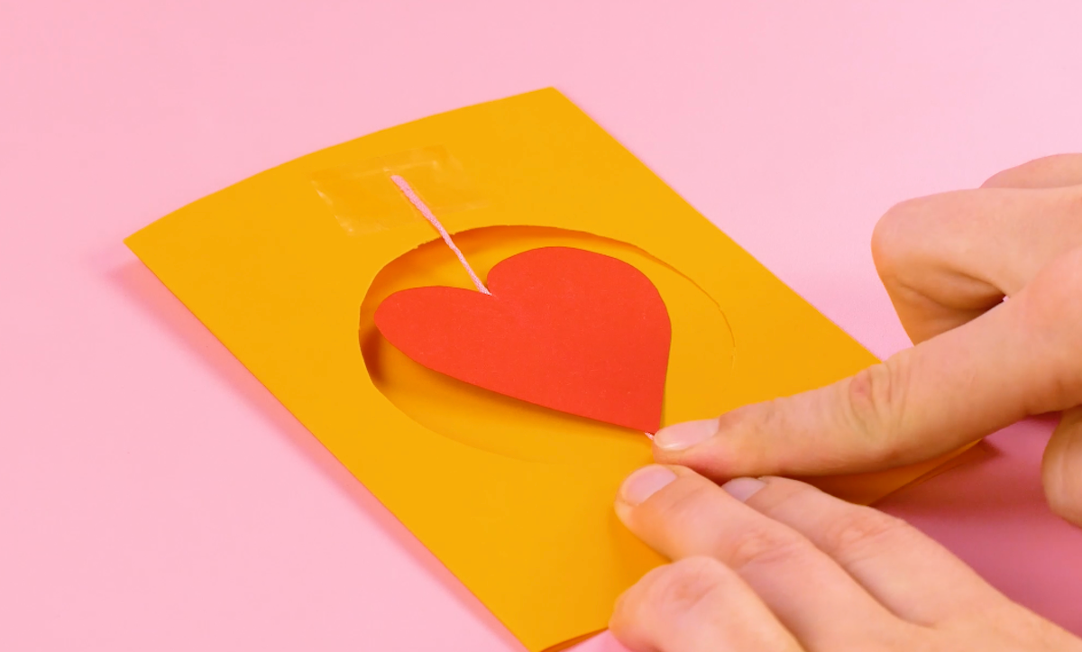 Heart with thread secured with adhesive tape