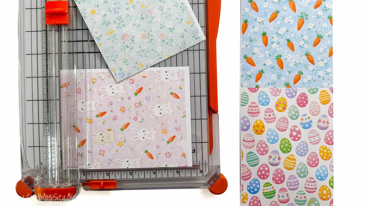 Paper trimmer slicing printed pastel Easter digital sheets, with individual sheets displaying carrots, eggs, floral designs, and bunny motifs.