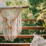 Boho wall hanging for your balcony made of yarn and wood